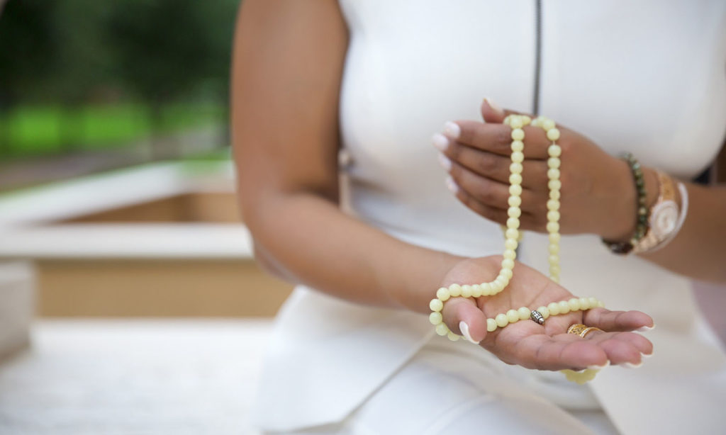 Mantra Chanting with Prayer beads image
