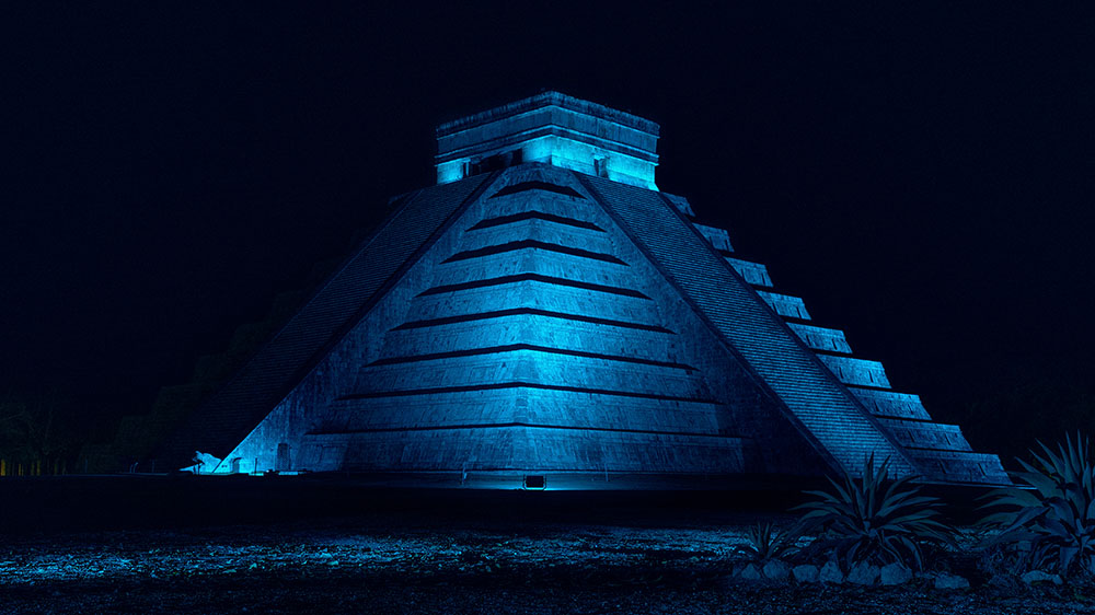 Spiritual Place Pyramid of Chichen Itza at night with blue light in Mexico Image