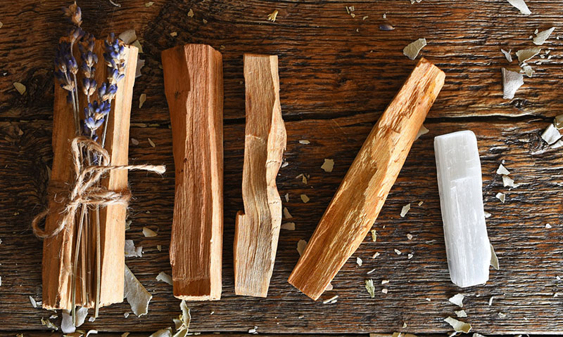 crystal cleansing with palo santo image